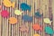 Colorful wooden fishes on the bamboo surface,