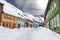 Colorful wooden houses snowed in