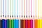 Colorful wooden pencils drawing lines isolated on white