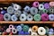 Colorful wool reels on the shelves in the manufacturing room