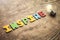 Colorful word Inspire and light bulb on wooden table. Inspiration and Creativity