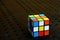 Colorful and world famous Rubik`s cube on a black background.