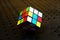 Colorful and world famous Rubik`s cube on a black background.