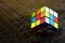 Colorful and world famous Rubik`s cube on a black background.