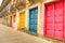 Colorful worn painted doors along street in Porto - Artistic portuguese city concept  - Warm filtered look