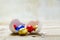 Colorful wrapped chocolate eggs in a white chicken eggshell on a