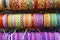 Colorful wristbands. Fabric textured background. Hand made