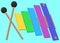 A colorful xylophone set with a pair of striking mallets all at a tilted angle lime blue backdrop