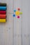 colorful yarn spools with decorative needles pushpins colorful buttons wooden desk. High quality photo