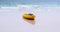 Colorful yellow kayaks on beach