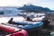 Colorful Zodiac boats on the beach coast of black sand volcanic rock and stones in glacier lagoon Fjallsarlon