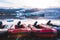 Colorful Zodiac boats on the beach coast of black sand volcanic rock and stones in glacier lagoon Fjallsarlon