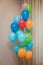 Colorfull balloons in a room.