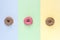 Colorfull Donuts with Icing on Colorfull Background Top View Three Tasty Donuts Horizontal