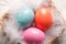 Colorfull Easter eggs on feather background