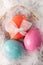 Colorfull Easter eggs on feather background