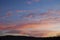 Colorfully clouds at sunset on a blue sky