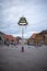 Colorfully decorated maypole stands on a marketplace