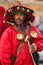 Colorfully dressed water seller at the Marrakech market, Morocco in North Africa