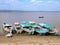 Colorfully painted passenger boats are moored on the eastern bank of the Irrawaddy river in Burma.