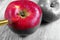 Coloring this world. artist brush painting apple. color and shape. red apple close-up.