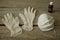 Colorless rubber gloves,  two industrial masks and bootle with pharmacy alcohol on wooden table