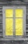 Colors 2021 Illuminating and Ultimate Gray, old wooden window and wall in yellow grey colours