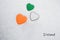 Colors of the irish flag Shamrock Green, White, Mango Tango painted on three hearts.