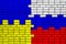 Colors of national flags of Ukraine and Russia on a brick wall