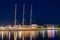 Colors of Tarragona port at night with beautiful moored yacht, Spain