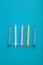 Coloruful birthday candles on blue background. Birthday celebration. Vertical photo