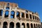 Coloseum against bright bluse sky in Rome Italy