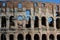 Coloseum against bright bluse sky in Rome Italy