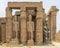 Colossal statue seated King at the entrance to the Colonnade Hall from the Rameses II Court of the Luxor Temple. the Luxor Temple.