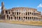 Colosseum or Coliseum in Rome, Italy. Ancient Roman Scenic view of Colosseum ruins in summer