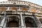 Colosseum famous and blackened grimy exterior closeup of iconic ancient arena, Rome