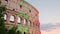Colosseum illuminated in Italian flag colors at evening in Rome, Italy