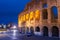 The Colosseum illuminated at night in Rome, Italy