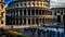 Colosseum, Rome, Italy. The square in front of the Colosseum in the warm colours of sunset