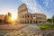 Colosseum in Rome and morning sun, Italy