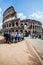 The Colosseum. A tourists group. Crowd of people.