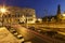 Colosseum and traffic lights at night