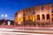 Colosseum at twilight with light trails in Rome, Italy