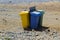 Colour coded rubbishe bins for re-cycling waste on a sunny beach in Teneriffe in Playa Las Americas in the Spanish Canary islands