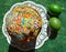 Colour Easter cake and green eggs on a green top view background, spring holiday