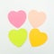 Colour  paper heart stick note on a white background