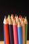 Colour pencils against chalkboard
