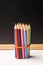 Colour pencils against chalkboard