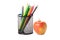 Colour pencils in a black holder with apple