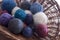 Coloured balls of wool in basket